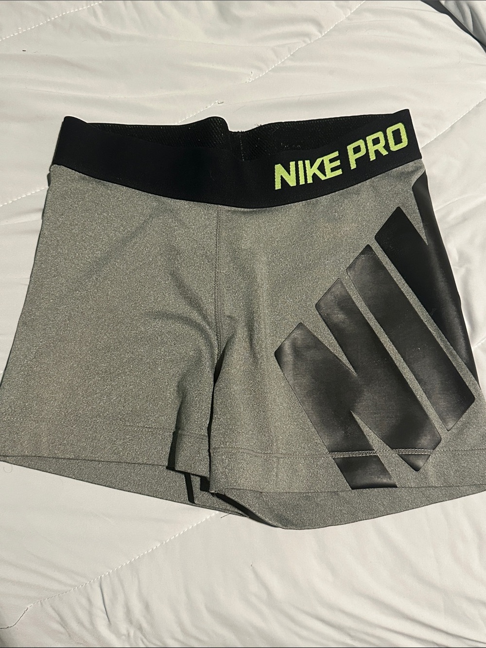Nike Pro Gray Athletic Shorts with Black Waistband and Neon Logo